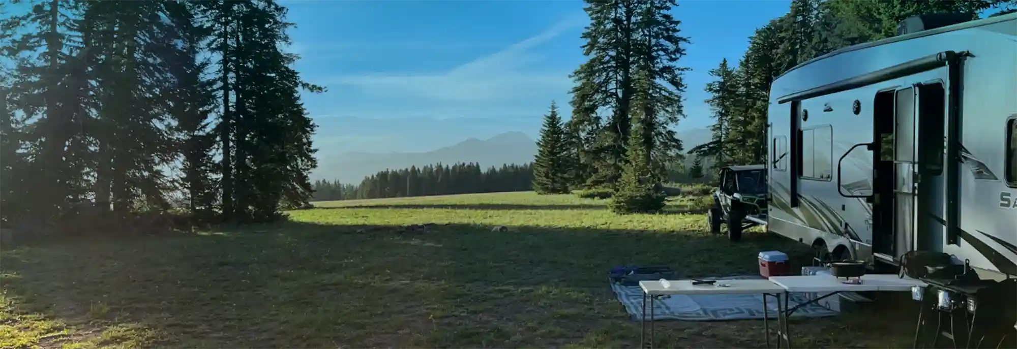 RV in forest clearing