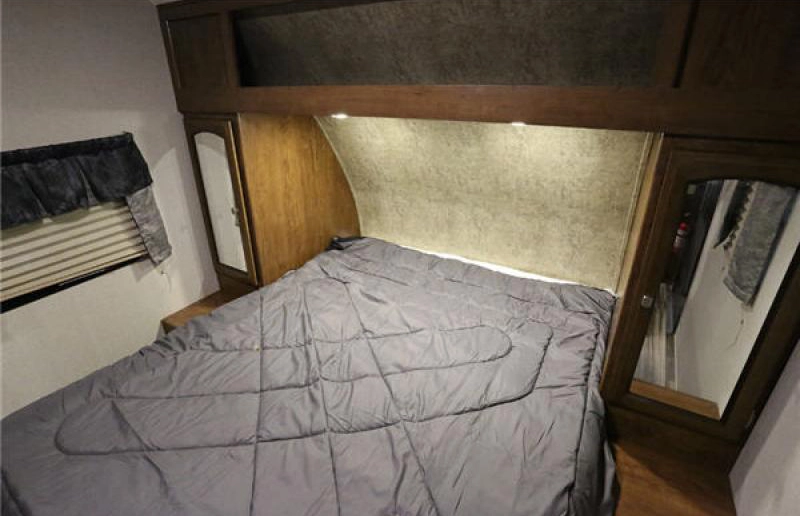 Coachmen Patriot travel trailer- bedroom with queen mattress