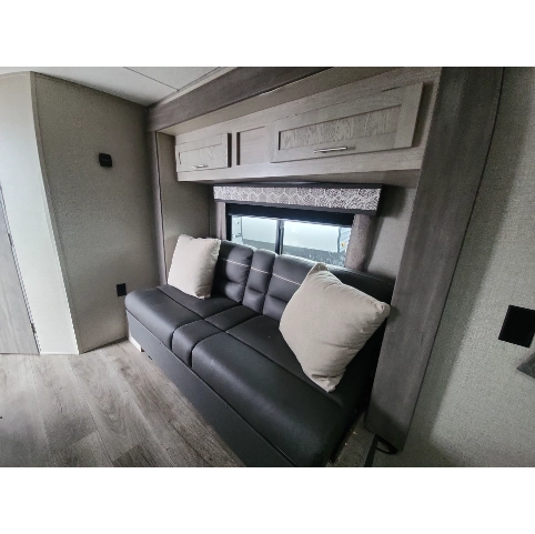 Coachmen Catalina Summit 184fqs-2 interior with couch and storage cabinets