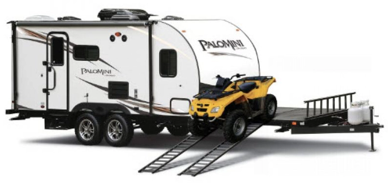 Palomino Palomini Travel Trailer with optional extra storage and off road package at front of RV