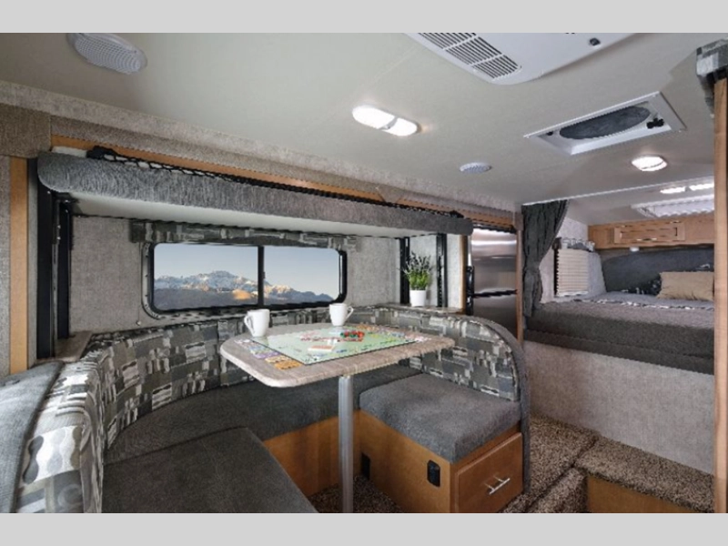 Adventurer LP truck camper- dinette and sleeping area