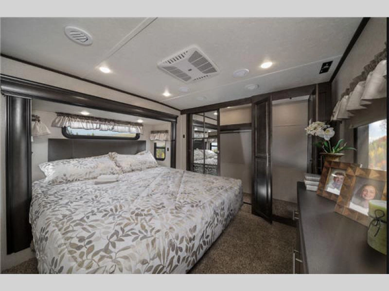 Brookstone fifth wheel- bedroom with king mattress and wardrobe storage