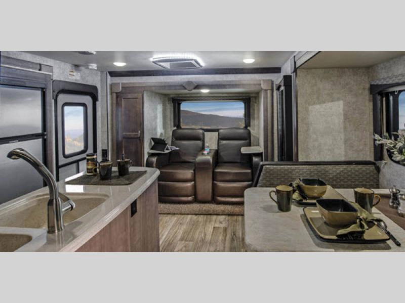 ALP Eagle Cap truck camper- interior with recliners, dinette, and kitchen