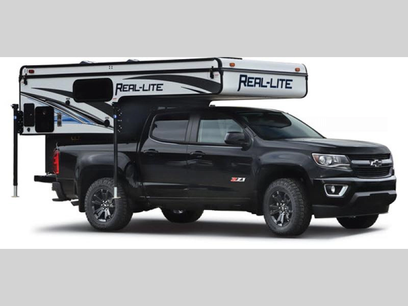 Palomino Real-Lite truck camper- soft side model with Rieco Titan electric roof lift