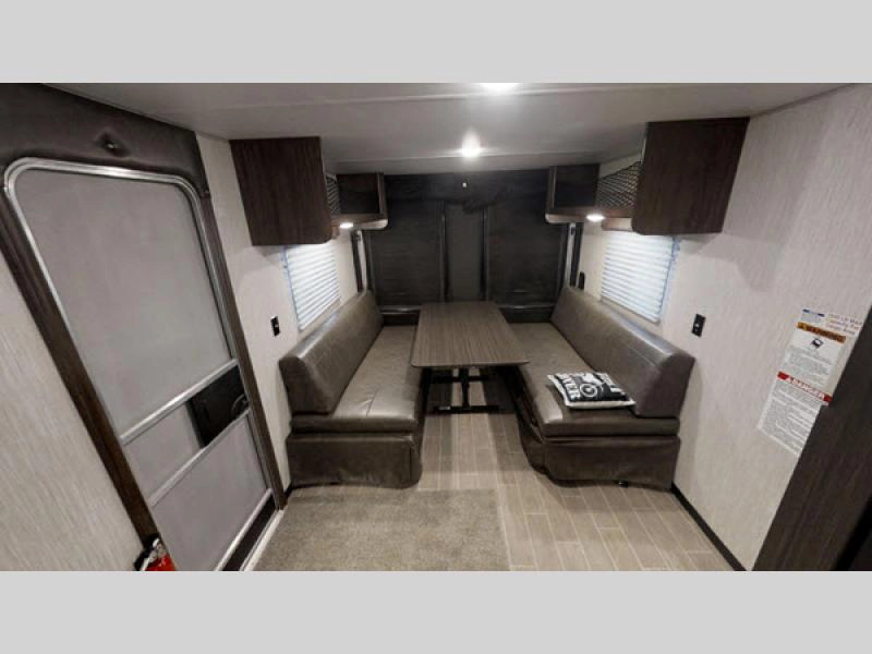 Cherokee Grey Wolf toy hauler- living area with sofas and table