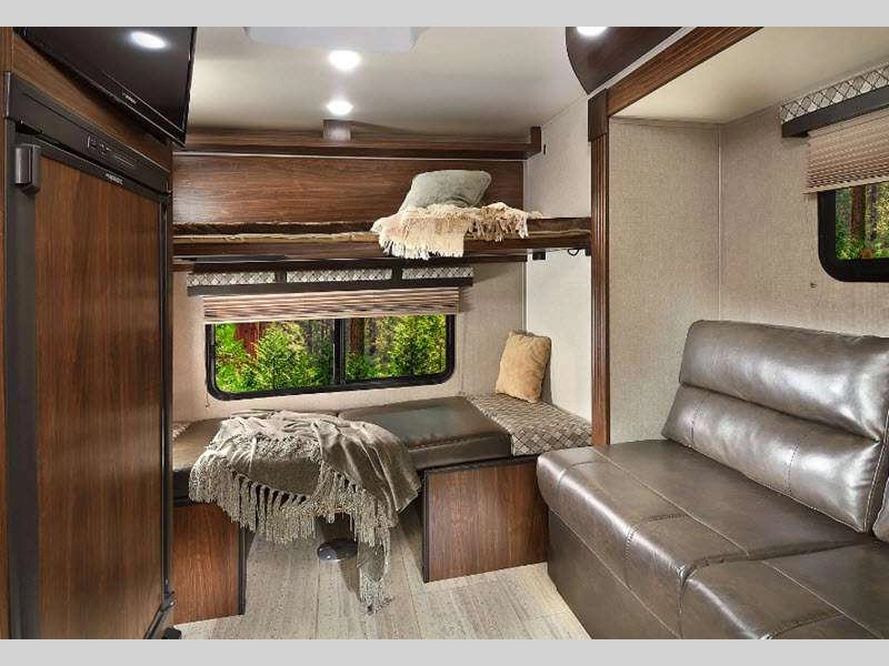 PaloMini travel trailer RV interior with bunks, sofa, storage, and LED lighting