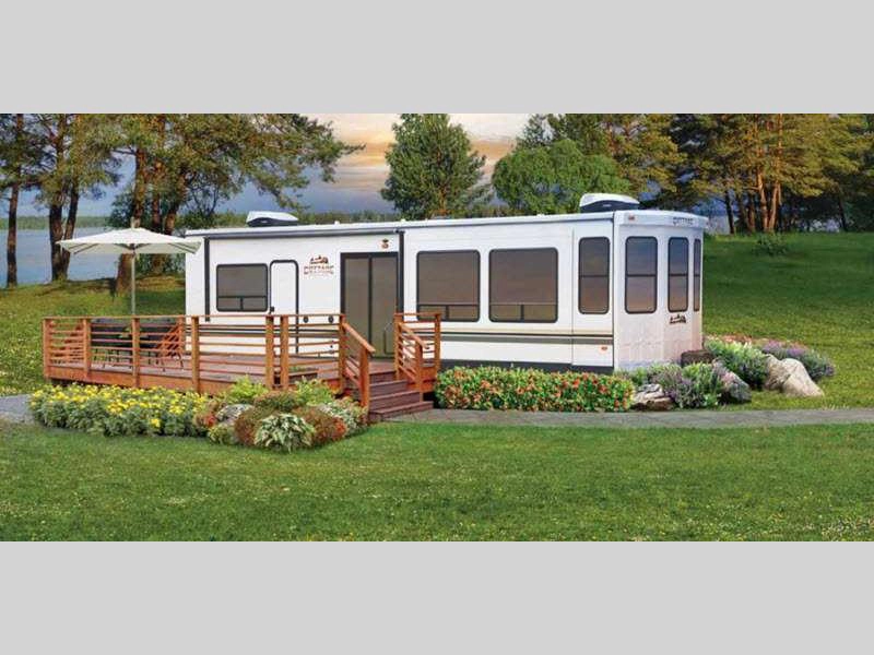 Cedar Creek Cottage destination trailer exterior with deck and garden