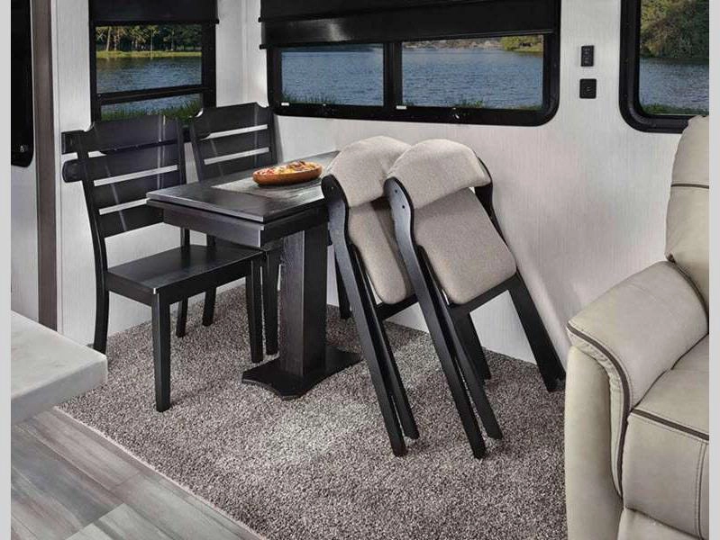 Cedar Creek Cottage destination trailer interior living space dining area with table and chairs