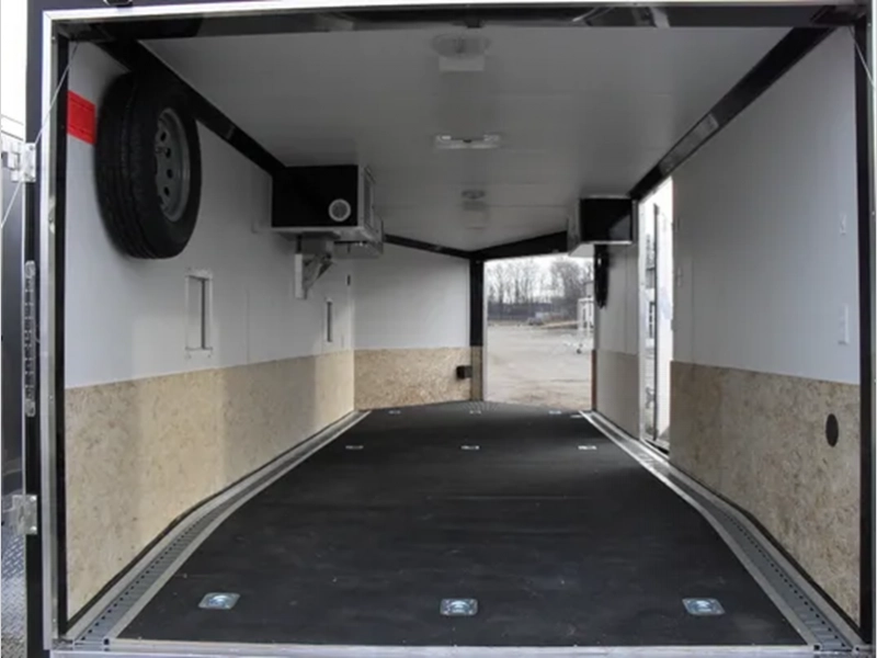 Mountaineer snowmobile trailer interior storage room with lighting and ventilation