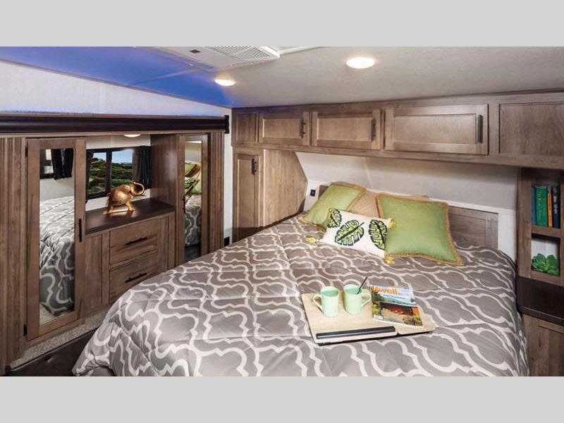 Cherokee Wolf Pack Toy Hauler- bedroom with king bed and storage