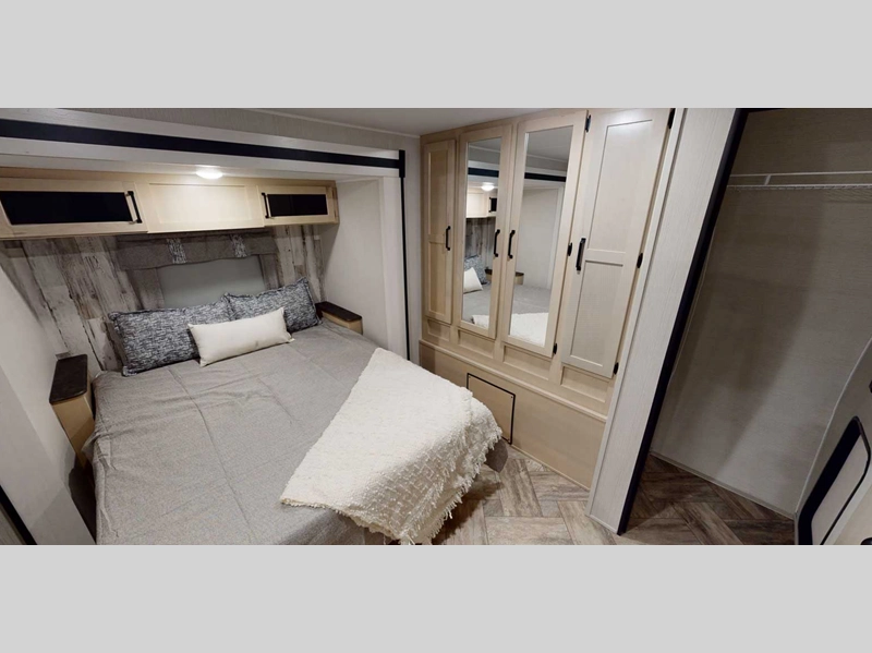 Puma Travel Trailer- bedroom with queen bed and closet