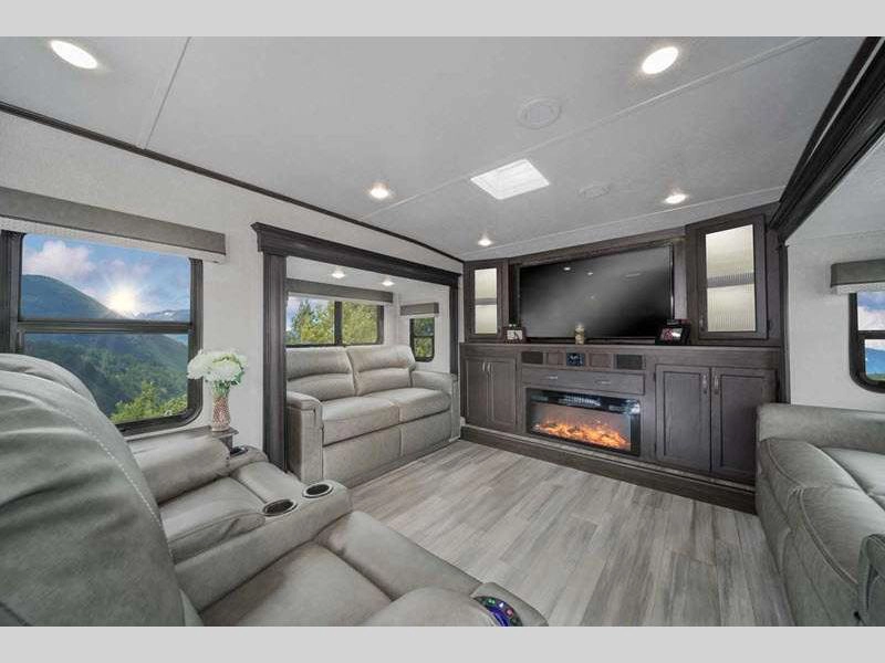 Brookstone Fifth Wheel RV- interior with electric fireplace, theatre seating, sofa, RV, & LED lighting