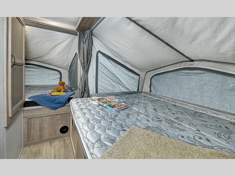 Interior of Solaire Expandable RV- spacious sleeping area with tent beds 