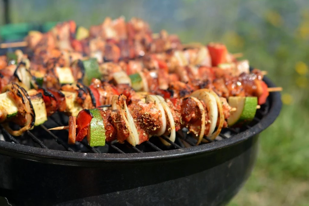 Meat and vegetable kabobs on a grill