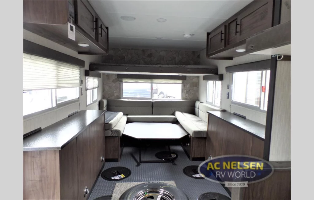 2020 Cherokee Grey Wolf 16BF fish house- interior with bunk, dinette, and countertops